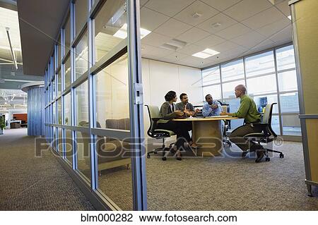 Stock Image - Multi-ethnic business people in meeting. Fotosearch