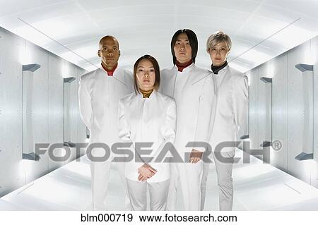 Stock Photo - Multi-ethnic co-workers in futuristic setting. Fotosearch