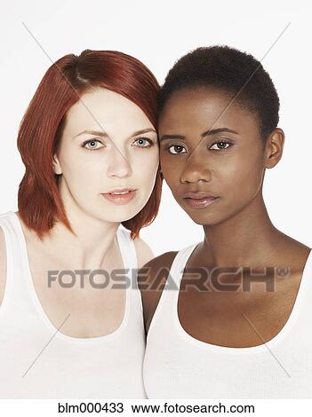 Stock Image - Multi-ethnic friends hugging. Fotosearch