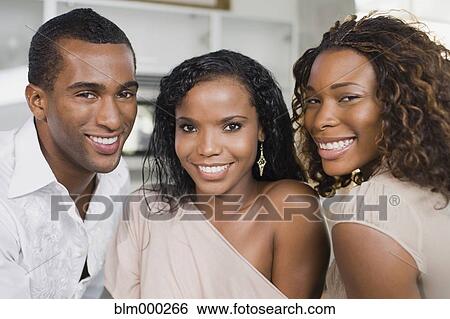 Stock Photograph - Multi-ethnic man and women smiling. Fotosearch