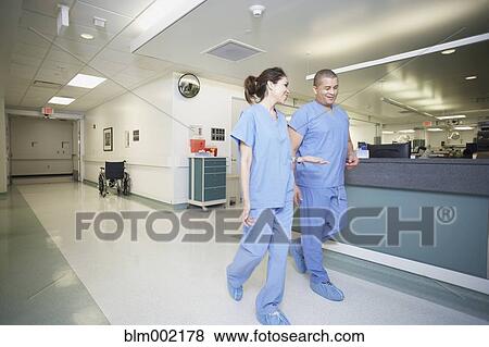 Stock Photo - Multi-ethnic medical professionals talking. Fotosearch