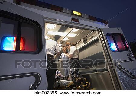 Multi-ethnic medical professionals with patient in ambulance View Large Photo Image Stock Photography - Multi-ethnic medical professionals with patient in ambulance. Fotosearch