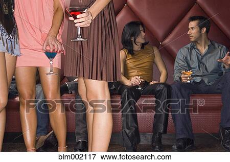Stock Photo - Multi-ethnic people at nightclub. Fotosearch