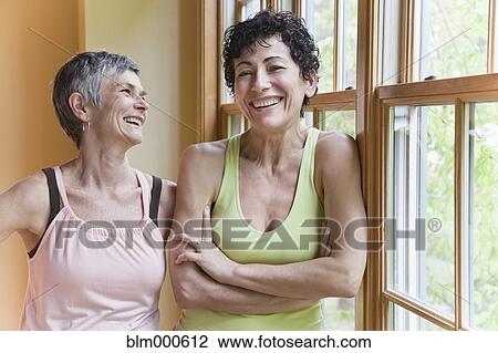 Stock Image - Multi-ethnic women laughing. Fotosearch