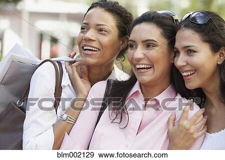 Multi-ethnic women laughing View Large Photo Image Stock Photo - Multi-ethnic women laughing. Fotosearch