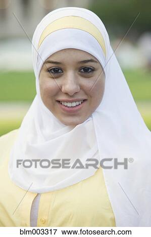 Muslim teenager smiling View Large Photo Image Stock Photo - Muslim teenager smiling. Fotosearch