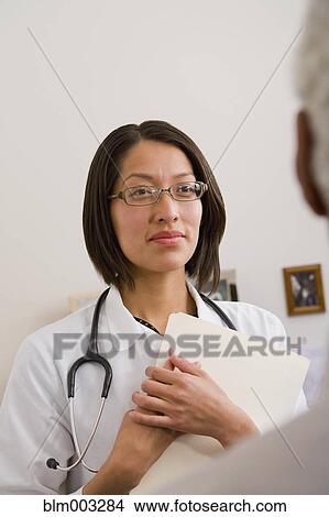 Native American doctor examining patient View Large Photo Image Picture - Native American doctor examining patient. Fotosearch