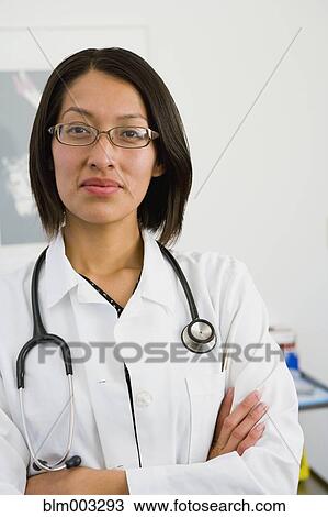 Native American doctor with arms crossed View Large Photo Image Stock Image - Native American doctor with arms crossed. Fotosearch