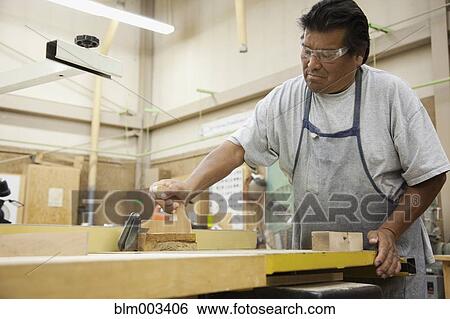 Native American man working in workshop View Large Photo Image Stock Photograph - Native American man working in workshop. Fotosearch