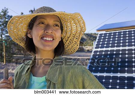 Native American woman standing near solar panels View Large Photo Image Stock Image - Native American woman standing near solar panels. Fotosearch