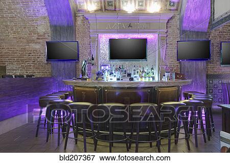 Stock Photo - Neon lights illuminating empty bar. Fotosearch