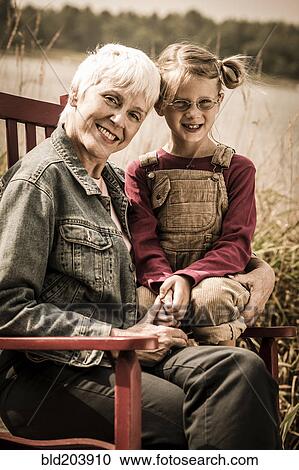 Older Caucasian woman smiling with granddaughter View Large Photo Image Stock Image - Older Caucasian woman smiling with granddaughter. Fotosearch