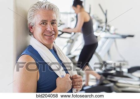 Stock Photo - Older Hispanic man smiling in gym. Fotosearch