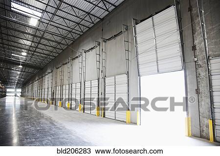 Open door at loading dock in warehouse View Large Photo Image Stock Image - Open door at loading dock in warehouse. Fotosearch