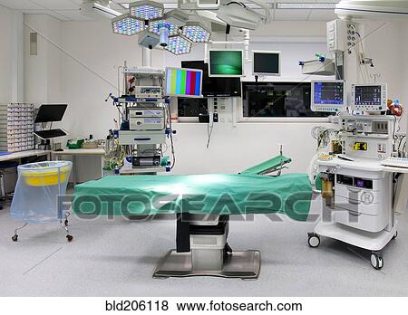Stock Photo - Operating table and equipment in vacant operating room. Fotosearch