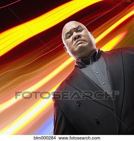 Picture - Pacific Islander man looking serious. Fotosearch