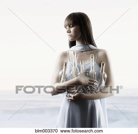 Stock Image - Pacific Islander woman holding bottles with messages. Fotosearch