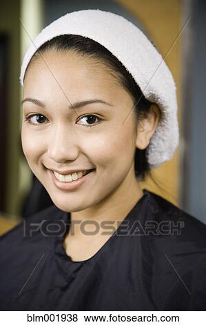 Stock Photo - Pacific Islander woman with towel on head. Fotosearch