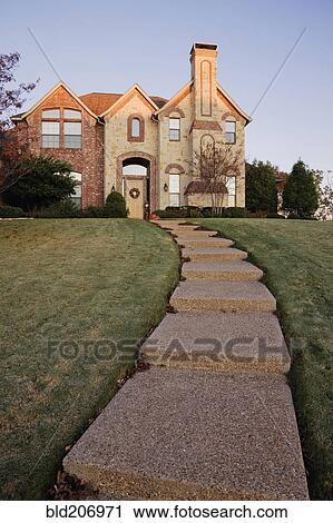 Stock Image - Pathway to Large Home on Hillside. Fotosearch