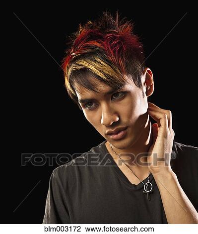 Stock Image - Pensive Asian man. Fotosearch
