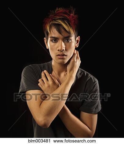 Stock Image - Pensive Asian man. Fotosearch