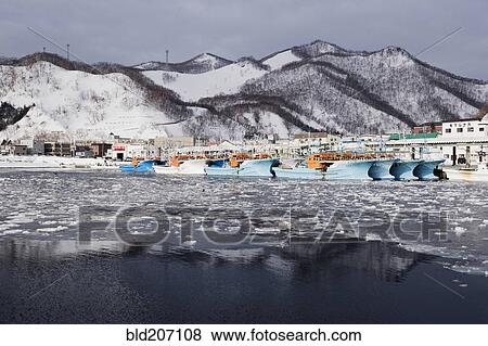 Stock Photo - Pier Light at Fishing Port Harbor. Fotosearch