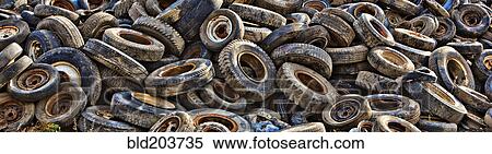 Pile of tires in junkyard View Large Photo Image Stock Photography - Pile of tires in junkyard. Fotosearch