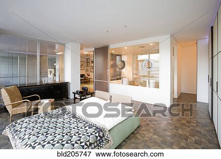 Stock Photo - Platform bed in modern bedroom. Fotosearch