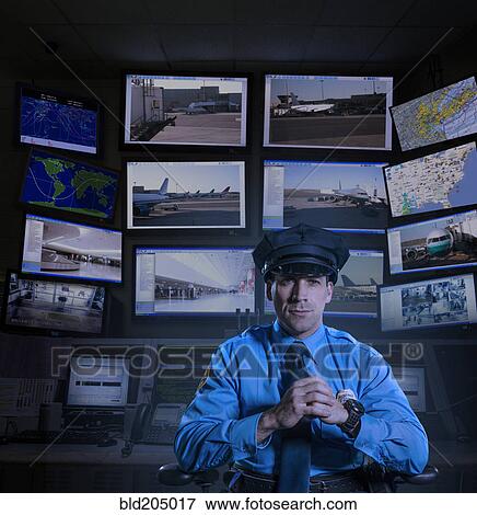Police officer working in control room View Large Photo Image Stock Photo - Police officer working in control room. Fotosearch