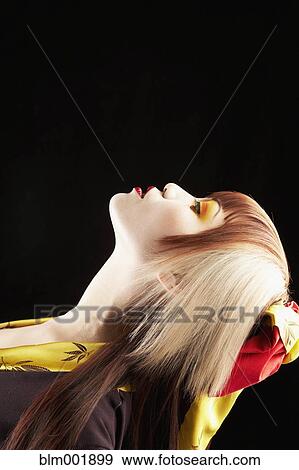 Stock Photo - Portrait of Asian woman in traditional clothing. Fotosearch
