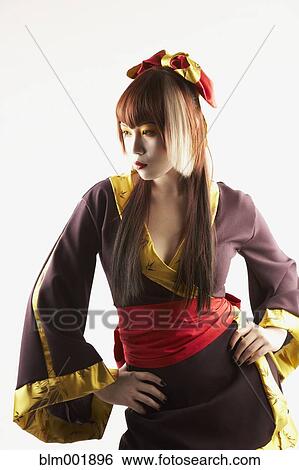 Stock Photograph - Portrait of Asian woman in traditional clothing. Fotosearch