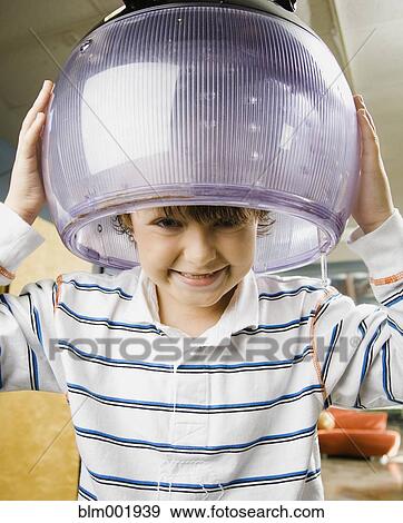 Stock Photo - Portrait of boy under hair dryer. Fotosearch