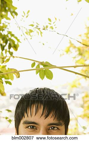 Stock Photo - Portrait of Hispanic teenage boy outdoors. Fotosearch