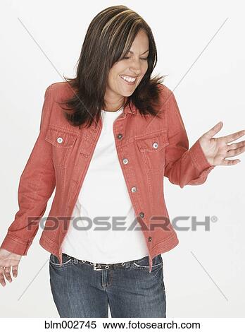 Stock Photography - Portrait of Hispanic woman dancing with eyes closed. Fotosearch