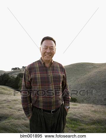 Portrait of senior Asian man in countryside View Large Photo Image Stock Photography - Portrait of senior Asian man in countryside. Fotosearch