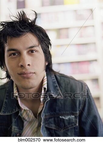 Stock Image - Portrait of young Hispanic man. Fotosearch