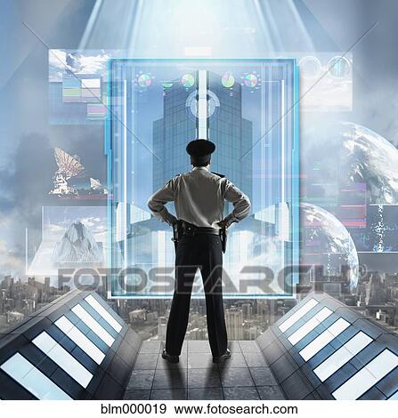 Stock Photo - Portuguese male security officer looking at holographic display. Fotosearch