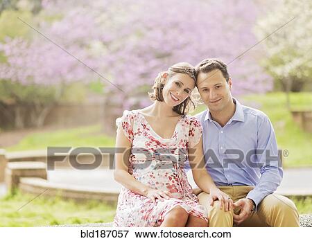 Pregnant Caucasian couple smiling outdoors View Large Photo Image Stock Photo - Pregnant Caucasian couple smiling outdoors. Fotosearch