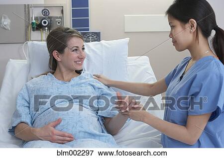 Pregnant woman in hospital View Large Photo Image Stock Photo - Pregnant woman in hospital. Fotosearch