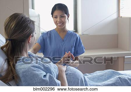 Stock Photograph - Pregnant woman in hospital. Fotosearch