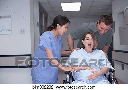 Stock Image - Pregnant woman in labor at hospital. Fotosearch