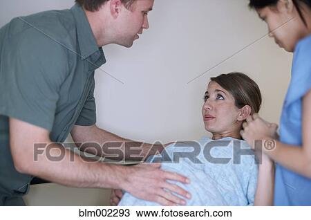 Stock Image - Pregnant woman in labor at hospital. Fotosearch