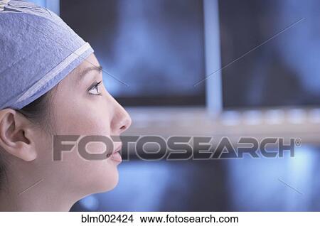 Picture - Profile of Asian female medical professional. Fotosearch