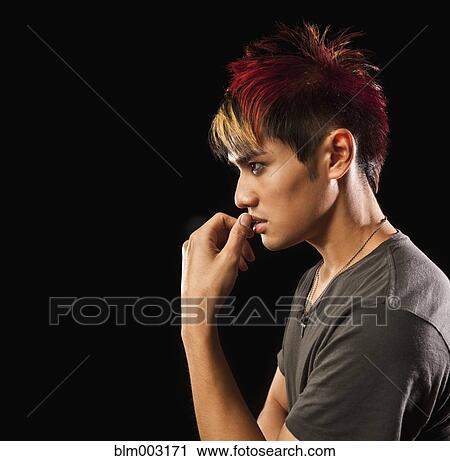 Stock Image - Profile of pensive Asian man. Fotosearch