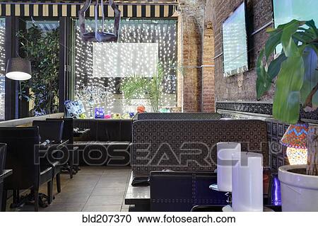 Restaurant interior with two candles on foreground View Large Photo Image Stock Image - Restaurant interior with two candles on foreground. Fotosearch
