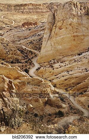 Stock Image - Road Through Craggy Desert. Fotosearch