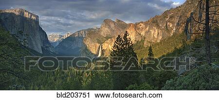 Stock Image - Rocky mountains overlooking rural valley, Yosemite, California, United States. Fotosearch