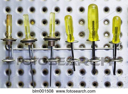 Row of screwdrivers on wall View Large Photo Image Stock Photo - Row of screwdrivers on wall. Fotosearch