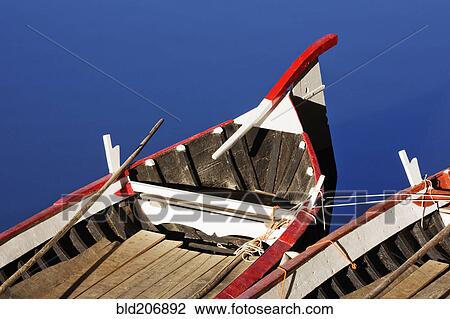 Stock Image - Rowing Boats Moored in Arno River. Fotosearch