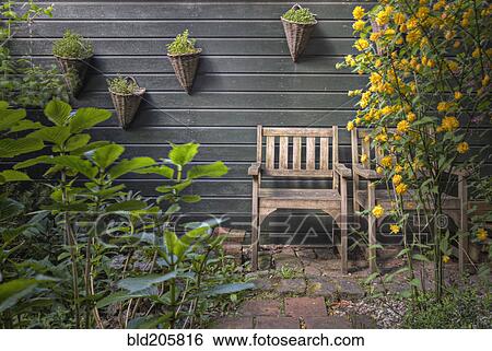Stock Photograph - Rustic Chairs in Garden. Fotosearch